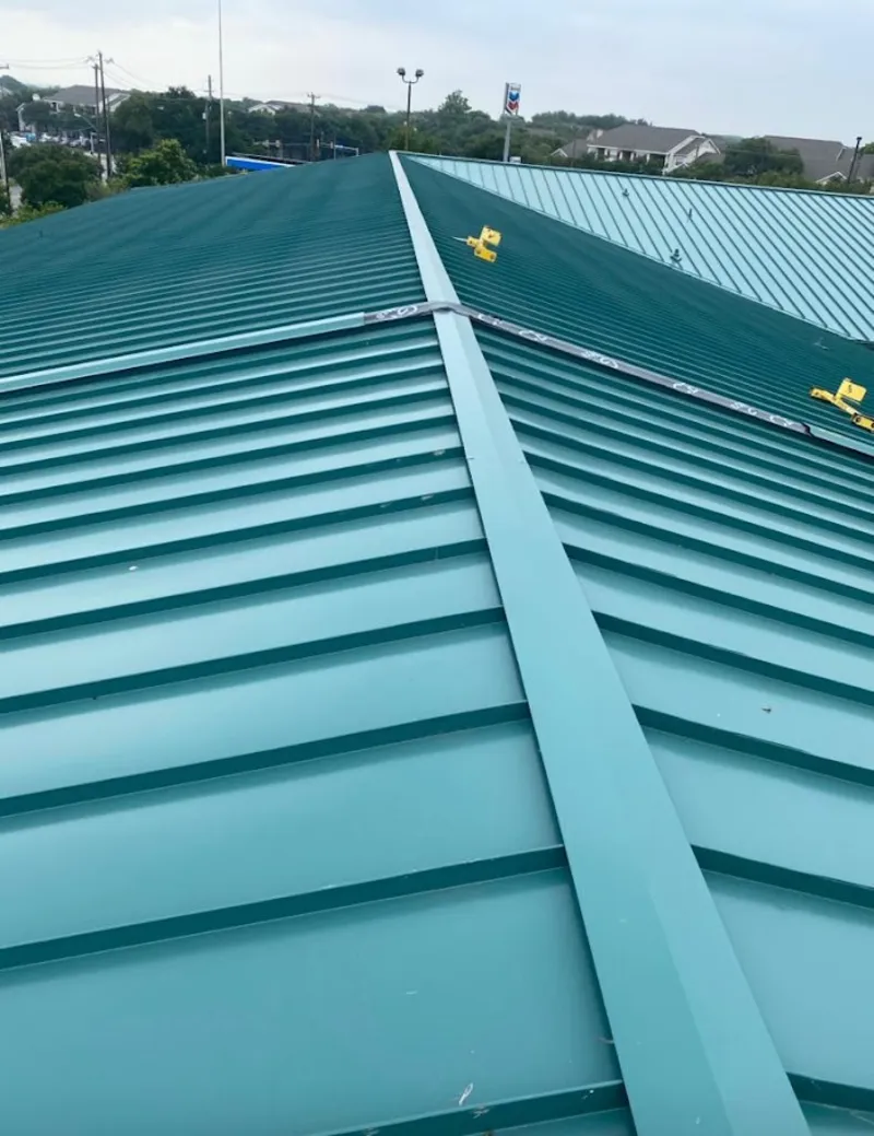 Green commercial metal roof ridge and valley for Metal Roof Repair in Wolfforth